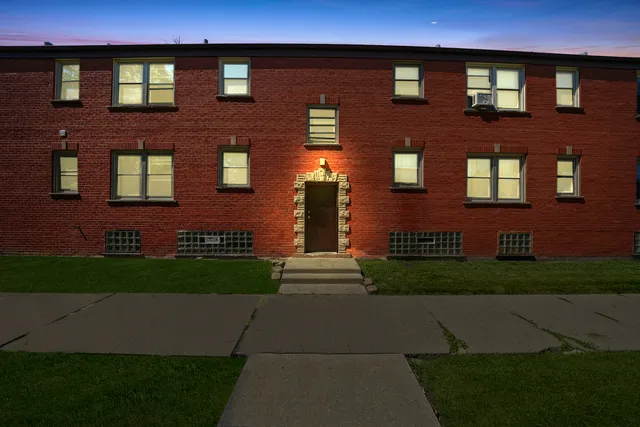 a front view of a building with garden