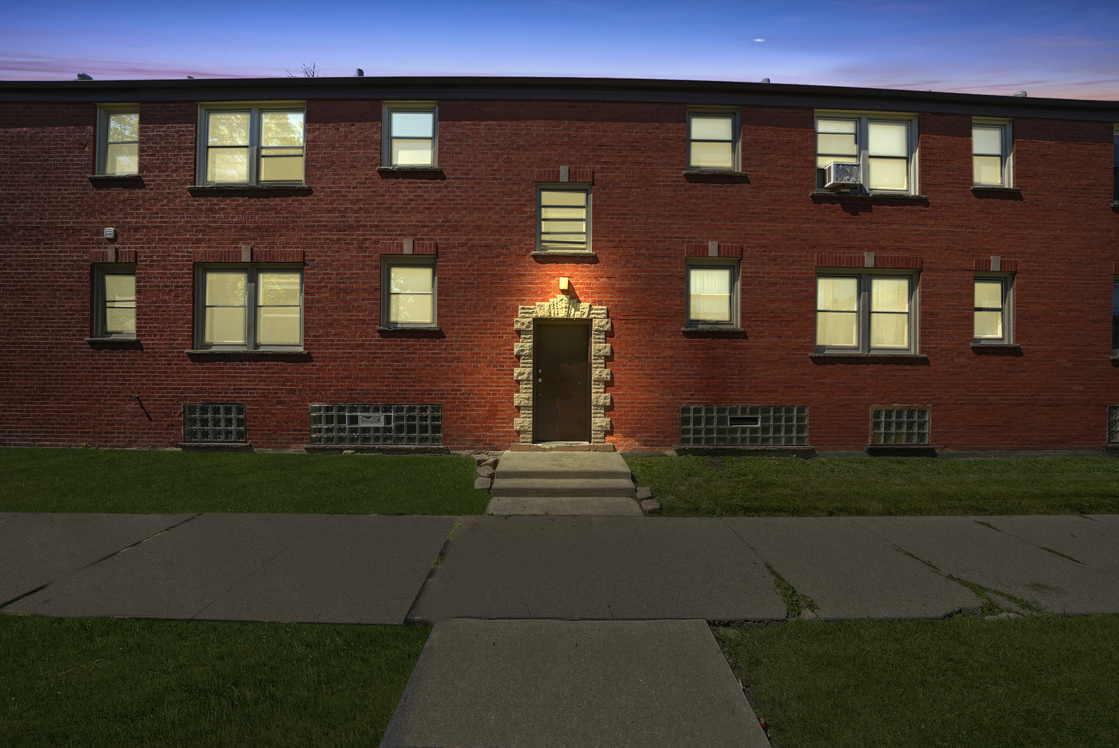 a front view of a building with garden