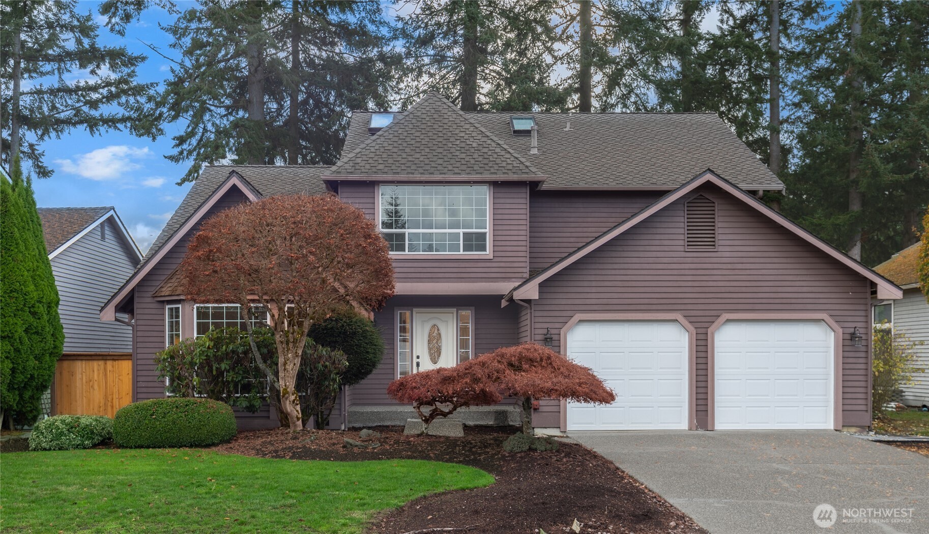 5824 111th Place Southwest Mukilteo, WA 98275 - Photo 1 of 38 a front view of a house with a garden and plants