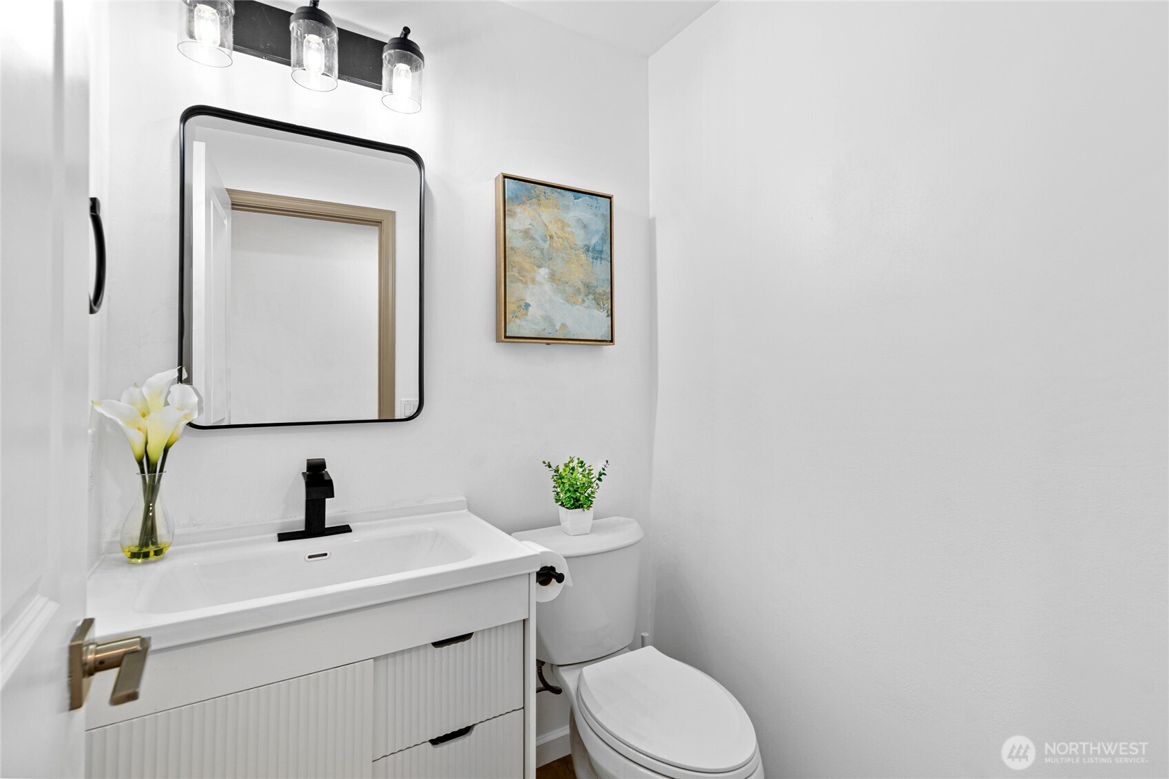 5824 111th Place Southwest Mukilteo, WA 98275 - Photo 16 of 38 a bathroom with a toilet sink and mirror