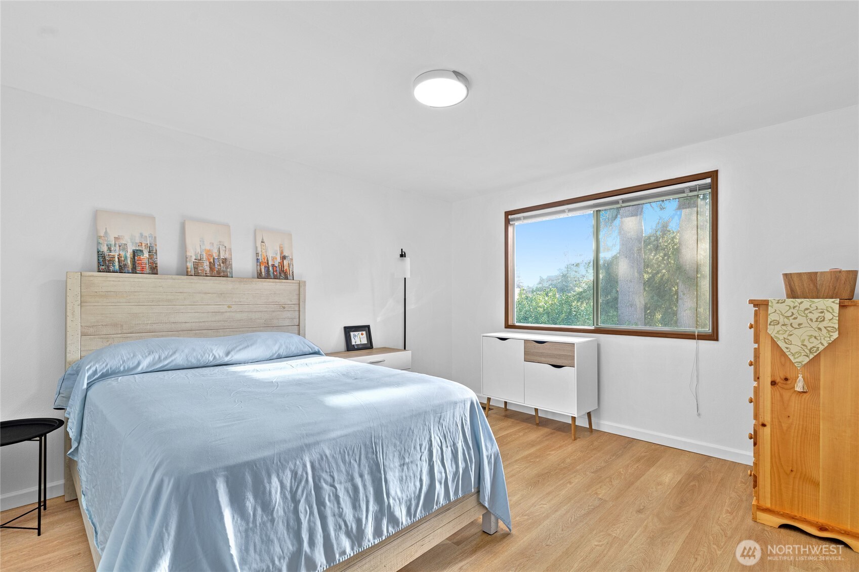 5824 111th Place Southwest Mukilteo, WA 98275 - Photo 17 of 38 a bedroom with a bed and wooden floor