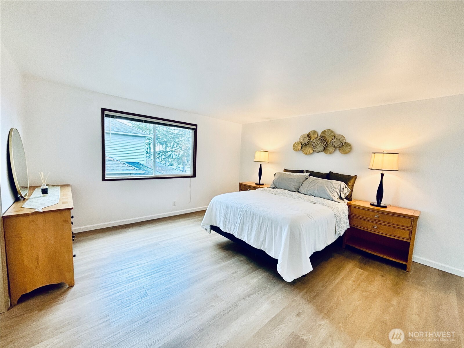 5824 111th Place Southwest Mukilteo, WA 98275 - Photo 21 of 38 a bedroom with a bed and a table