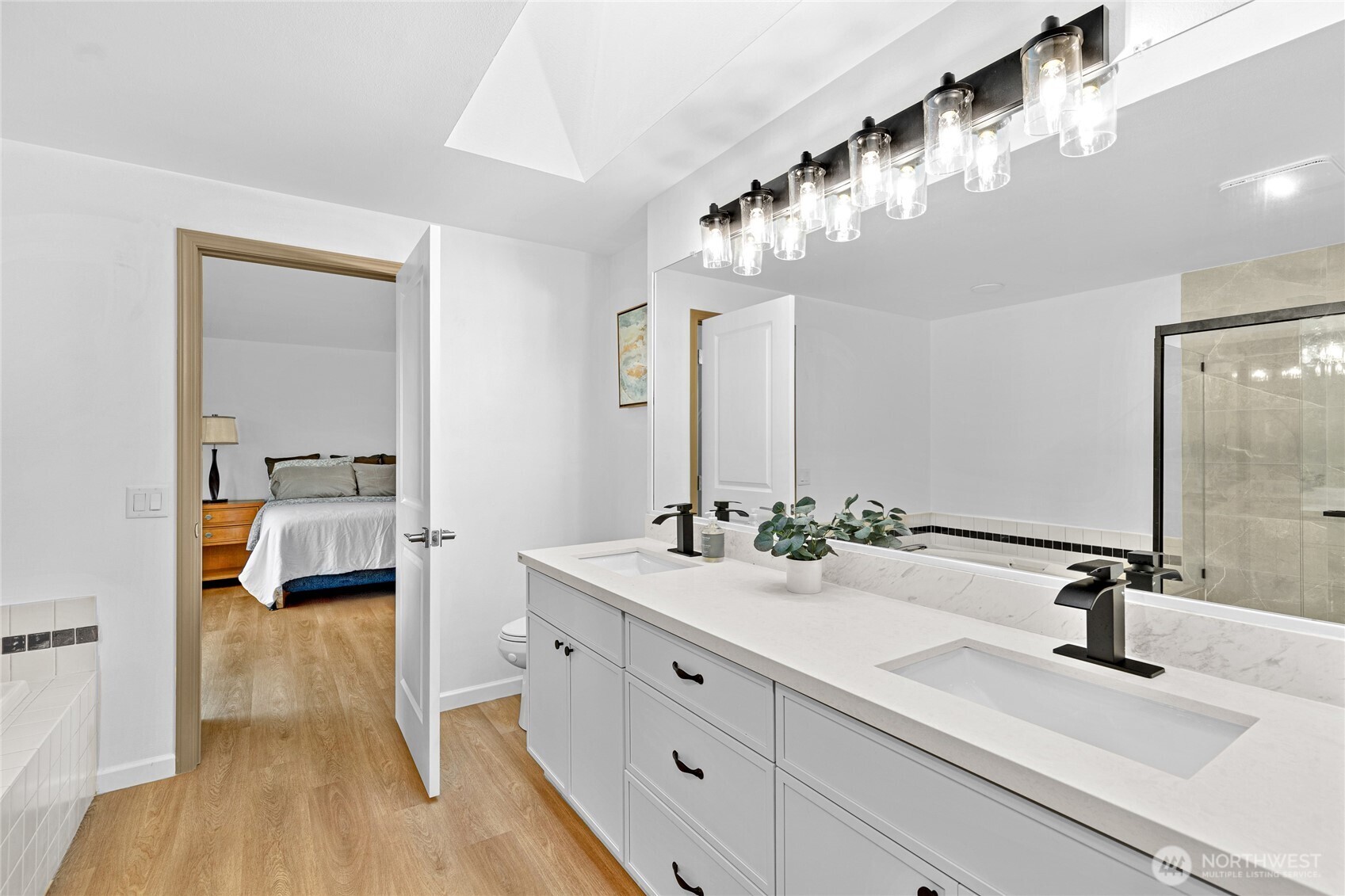 5824 111th Place Southwest Mukilteo, WA 98275 - Photo 23 of 38 a en suite spacious bathroom with a double vanity sink and a mirror