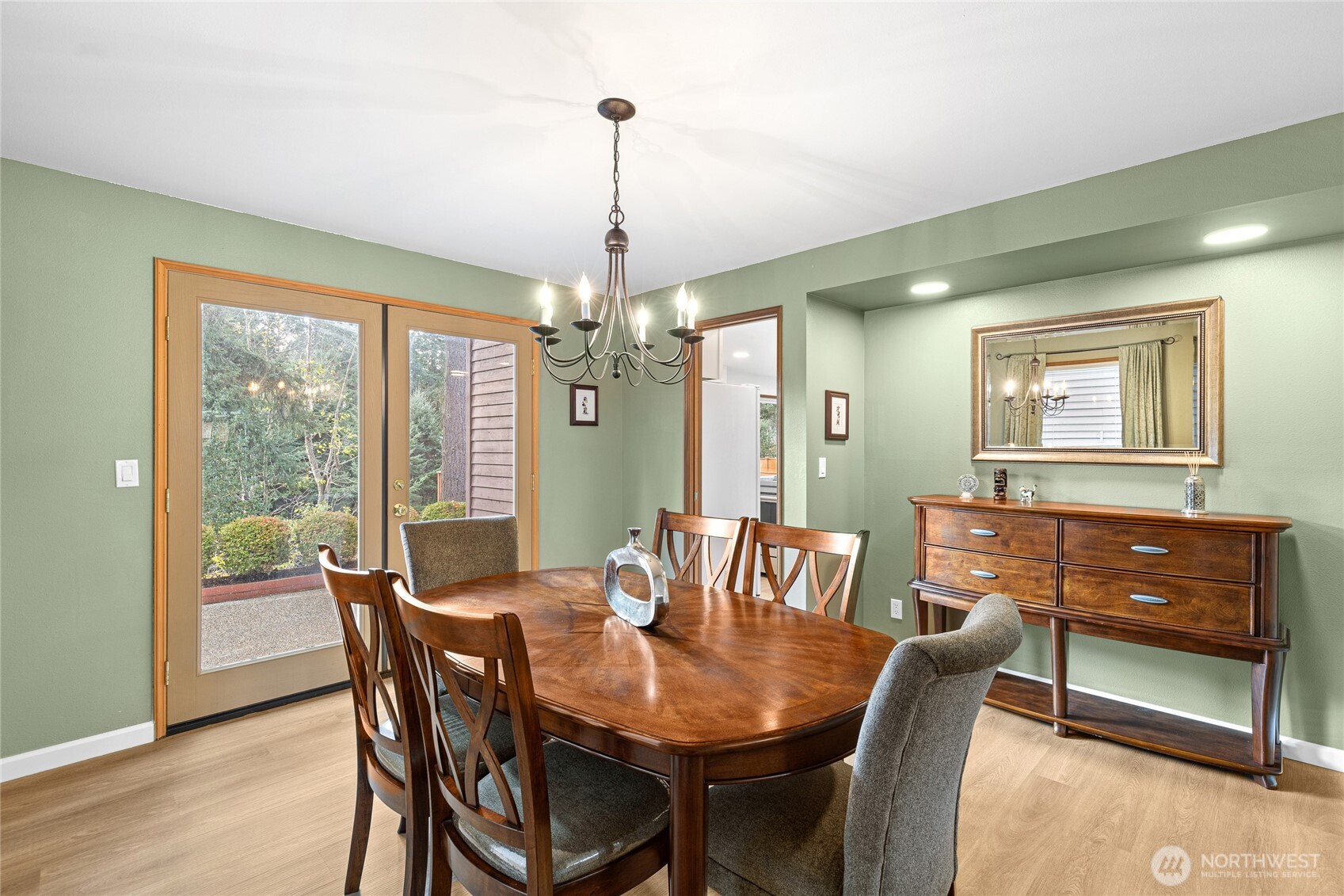 5824 111th Place Southwest Mukilteo, WA 98275 - Photo 6 of 38 a view of a dining room with furniture window and wooden floor