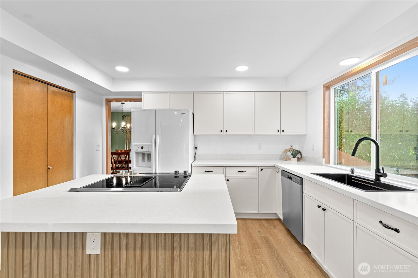5824 111th Place Southwest Mukilteo, WA 98275 - Photo 9 of 38 a kitchen with a sink cabinets and wooden floor
