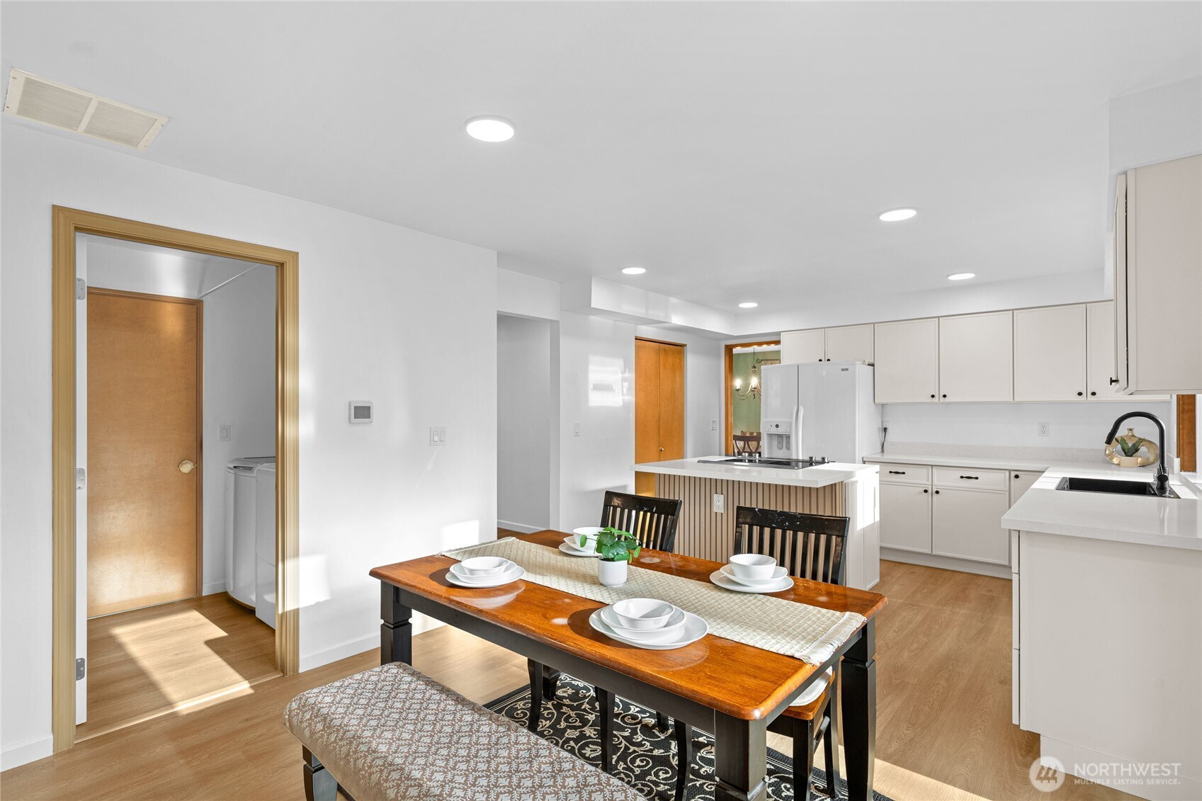 5824 111th Place Southwest Mukilteo, WA 98275 - Photo 10 of 38 a living room with stainless steel appliances furniture a rug and a kitchen view