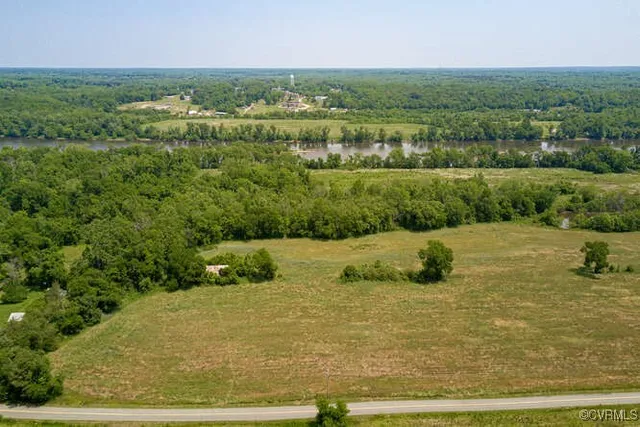 a view of a field with an ocean