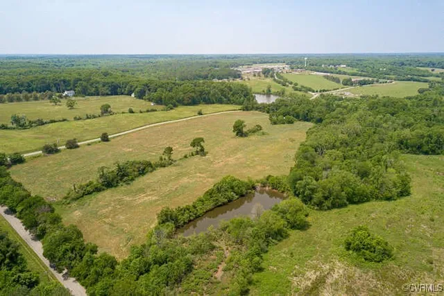 an aerial view of a city with a lake view