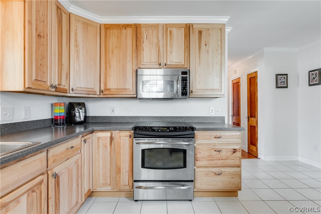 1910 Seddon Road Richmond, VA 23227 - Photo 13 of 39 a kitchen with granite countertop a stove top oven cabinetry and garage