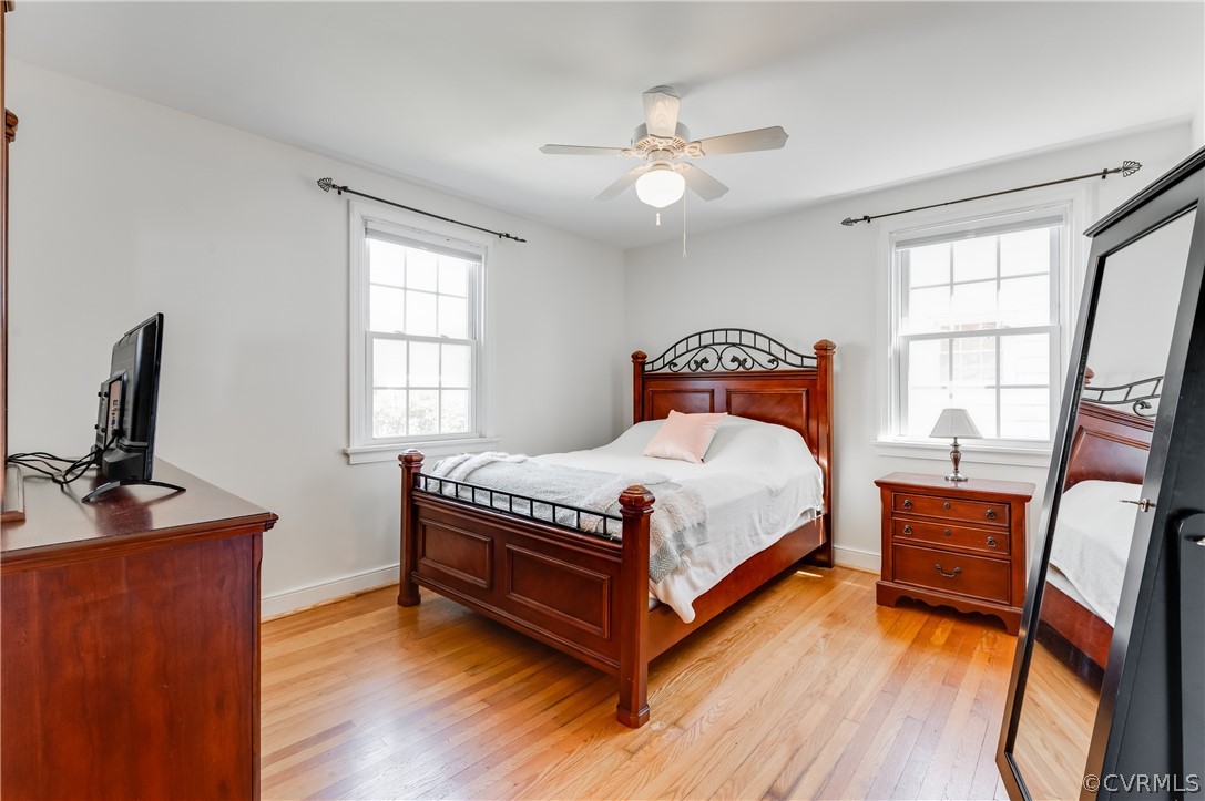 1910 Seddon Road Richmond, VA 23227 - Photo 18 of 39 a bedroom with a bed and a flat tv screen on the dresser
