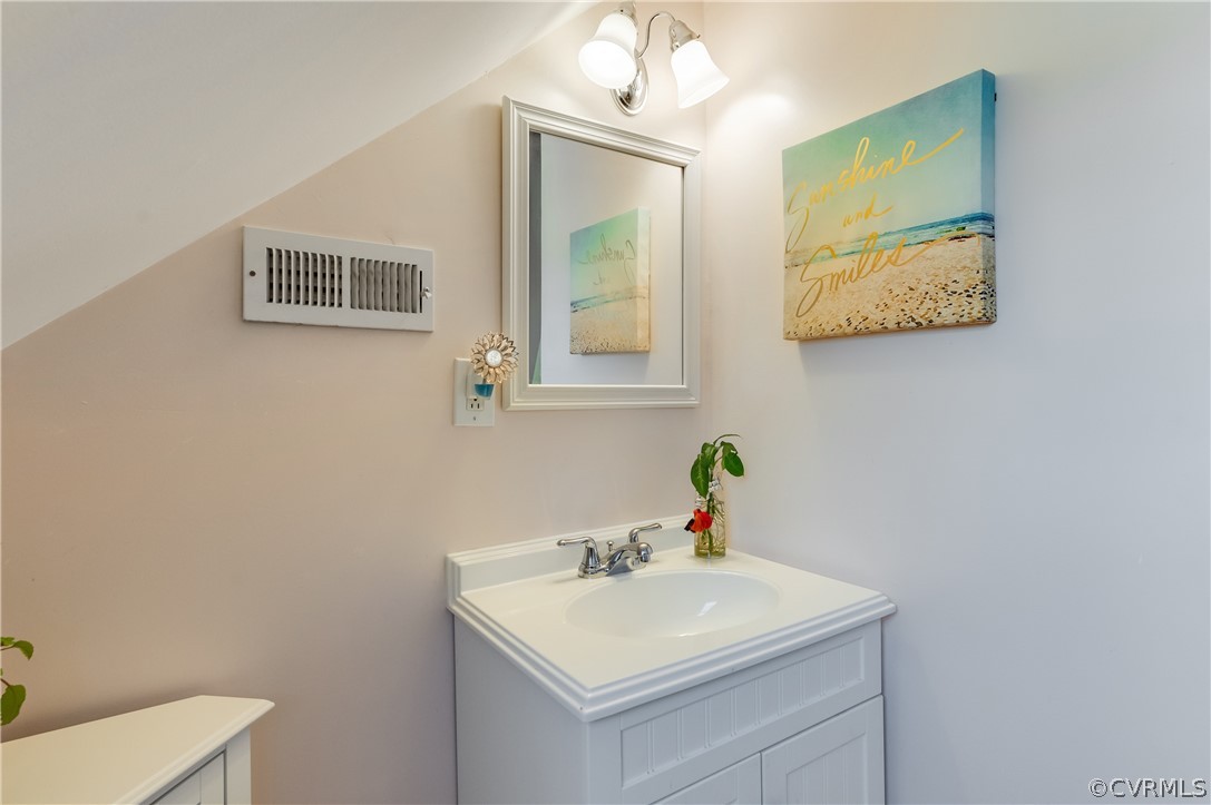 1910 Seddon Road Richmond, VA 23227 - Photo 29 of 39 a bathroom with a sink and a mirror