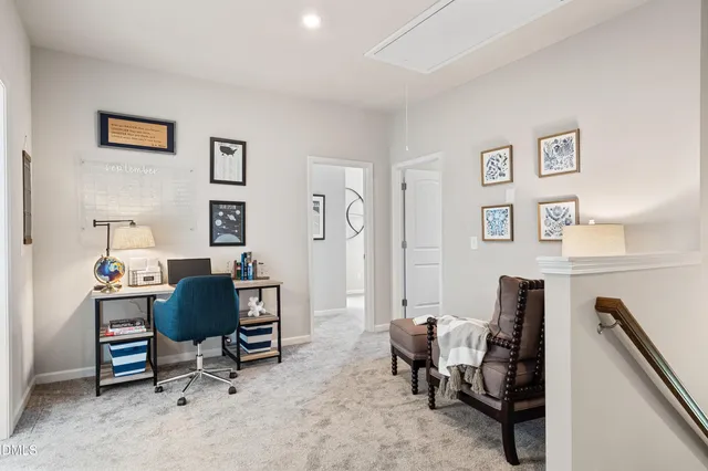 a view of a workspace with furniture and a cabinet