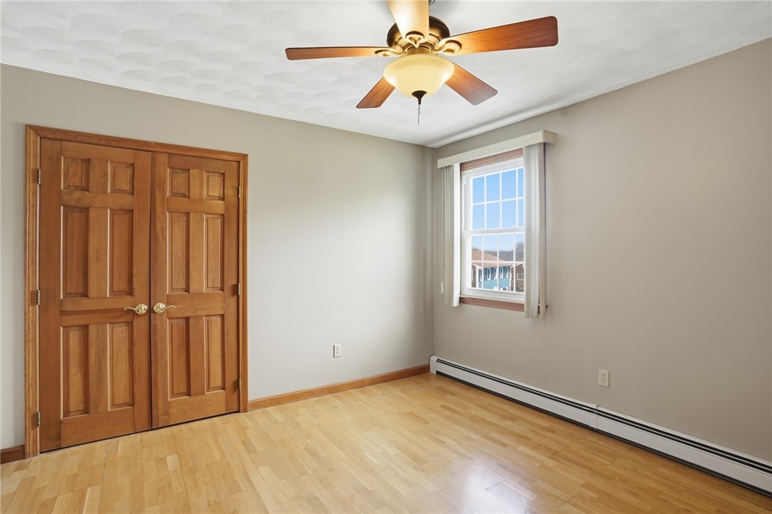 24 Sandy Lane Bristol, RI 02809 - Photo 17 of 27 Third bedroom across from main hall full bathroom.