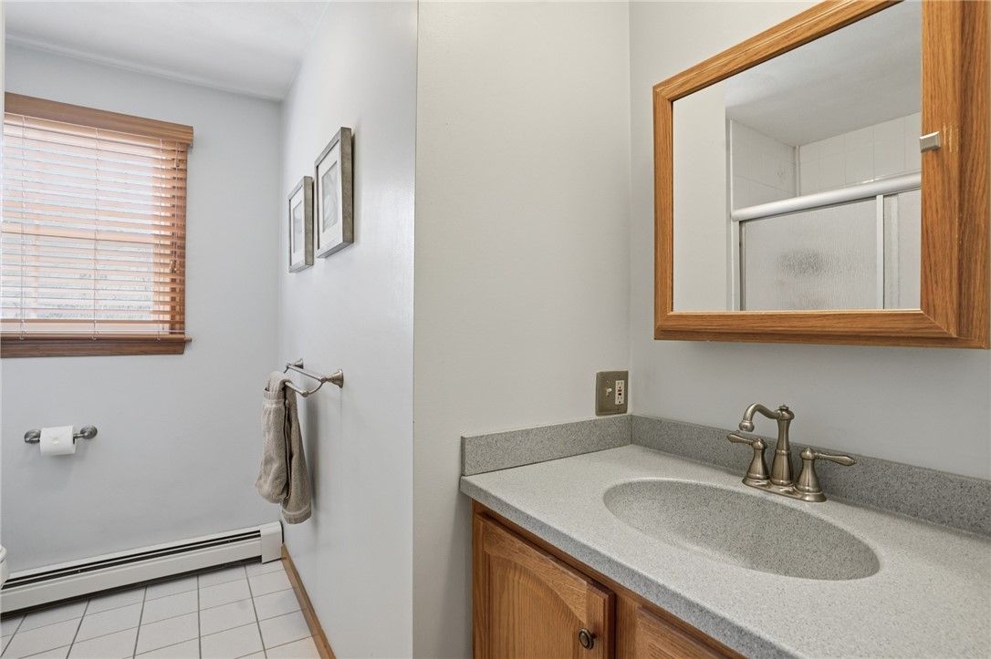 24 Sandy Lane Bristol, RI 02809 - Photo 18 of 27 Full bathroom with shower/tub off main hall.