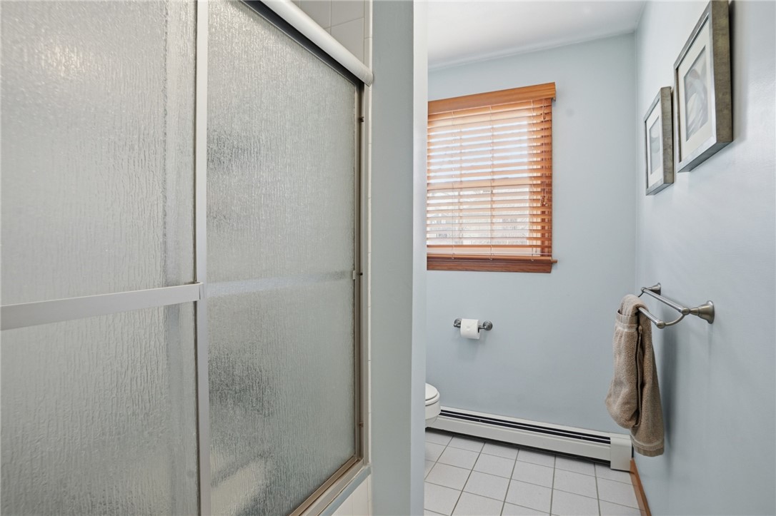24 Sandy Lane Bristol, RI 02809 - Photo 19 of 27 Full bathroom with shower/tub off main hall.