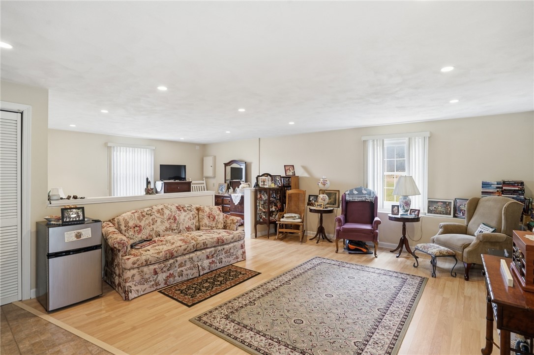 24 Sandy Lane Bristol, RI 02809 - Photo 20 of 27 Lower level family room used as studio with bedroom area with walk out to back yard.