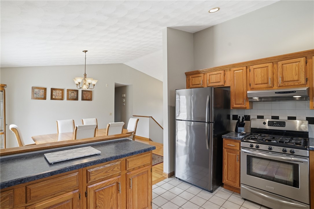 24 Sandy Lane Bristol, RI 02809 - Photo 4 of 27 Sun filled kitchen open to dining area.