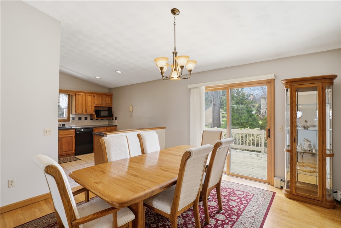 24 Sandy Lane Bristol, RI 02809 - Photo 6 of 27 Dining area leading to back deck with Southern exposure.