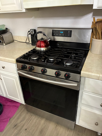 547 East 2000th Street North Vernal, UT 84078 - Photo 7 of 50 Stainless steel gas range with a black cooktop and integrated oven