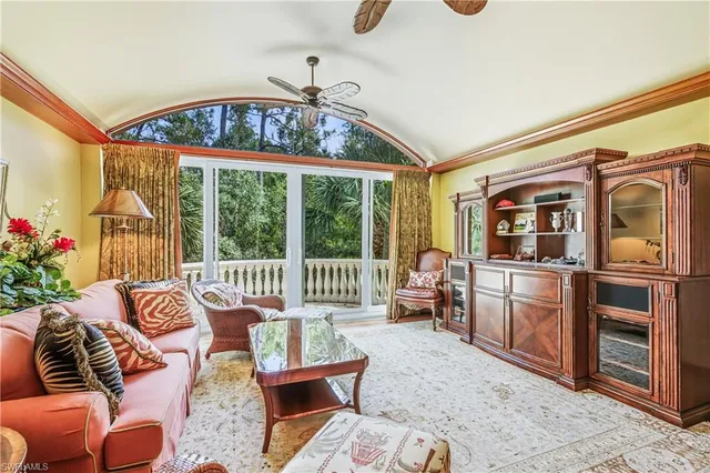 a dining hall with stainless steel appliances granite countertop a stove and a wooden floors