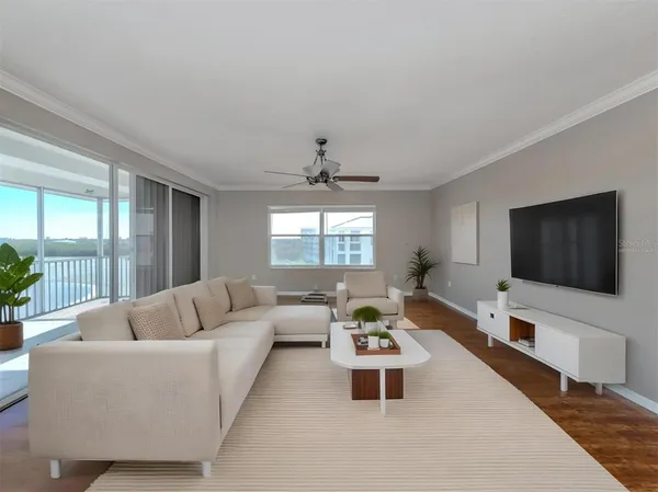 a view of empty room with wooden floor and window