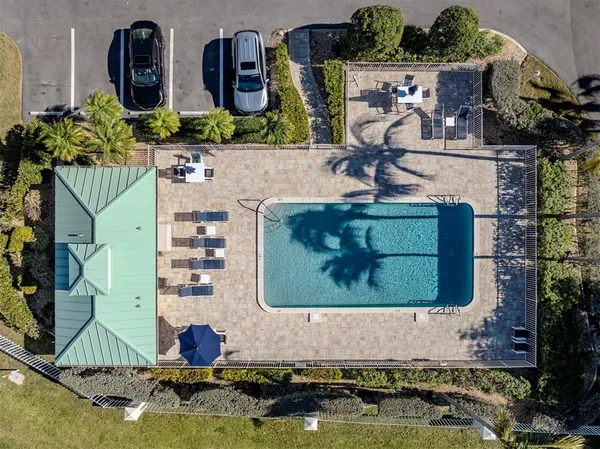 an aerial view of a house with a garden and plants