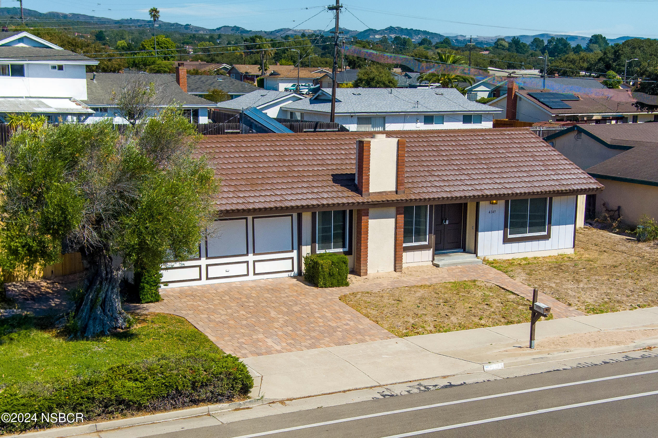 4149 Constellation Road Lompoc, CA 93436 - Photo 1 of 31 a front view of a house with a yard