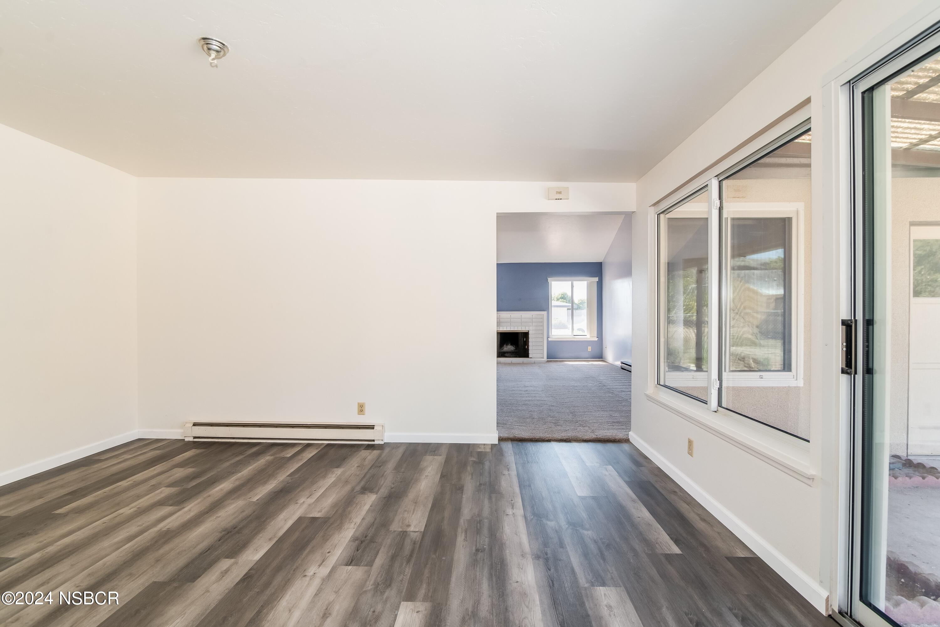 4149 Constellation Road Lompoc, CA 93436 - Photo 11 of 31 a view of empty room with wooden floor and fan