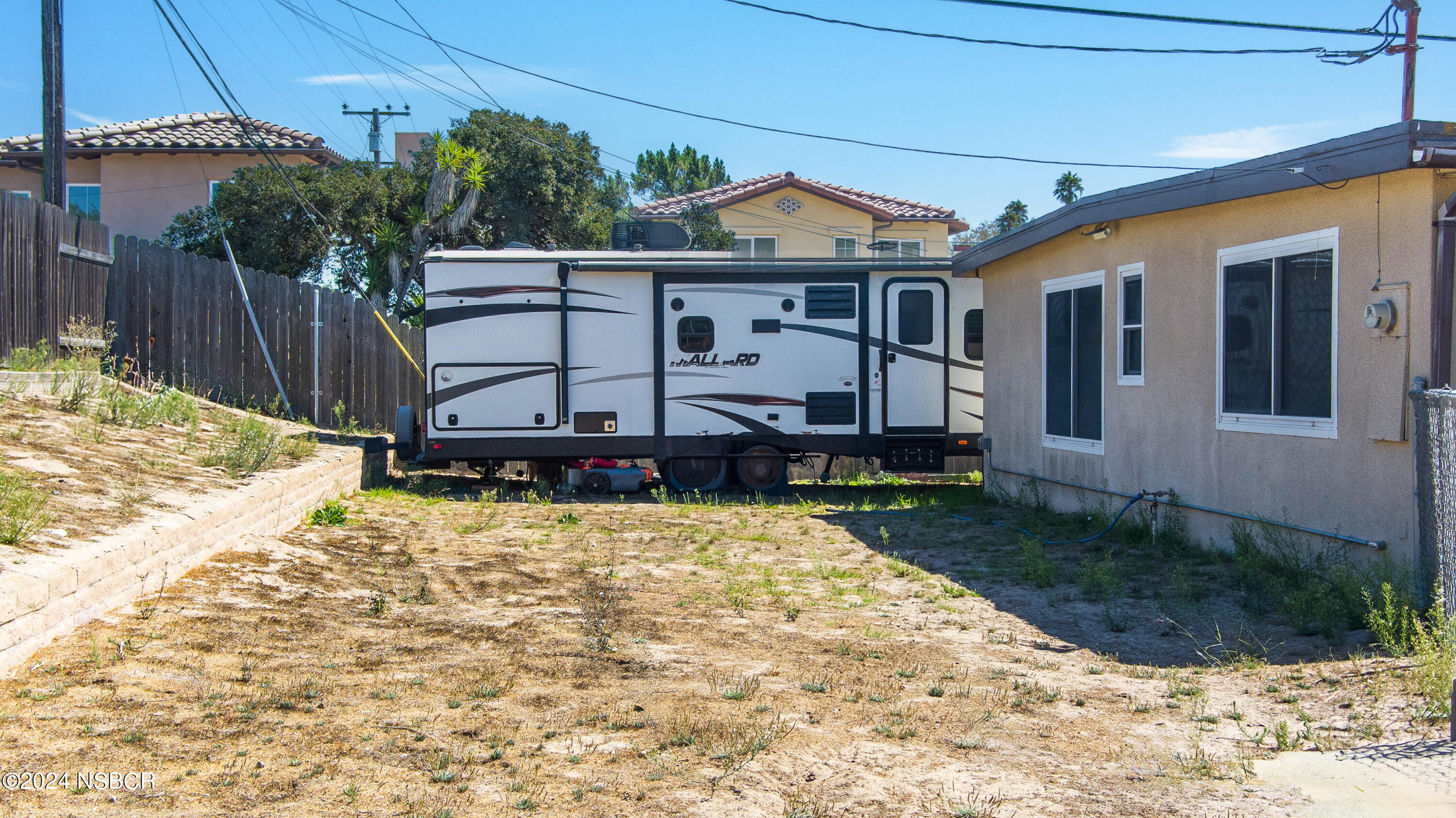 4149 Constellation Road Lompoc, CA 93436 - Photo 25 of 31 a view of a house with a yard
