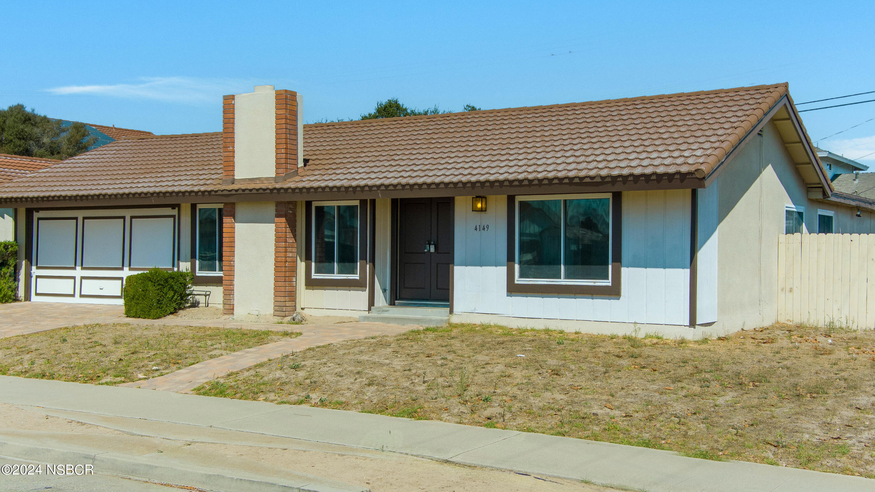 4149 Constellation Road Lompoc, CA 93436 - Photo 5 of 31 a front view of a house with a garden