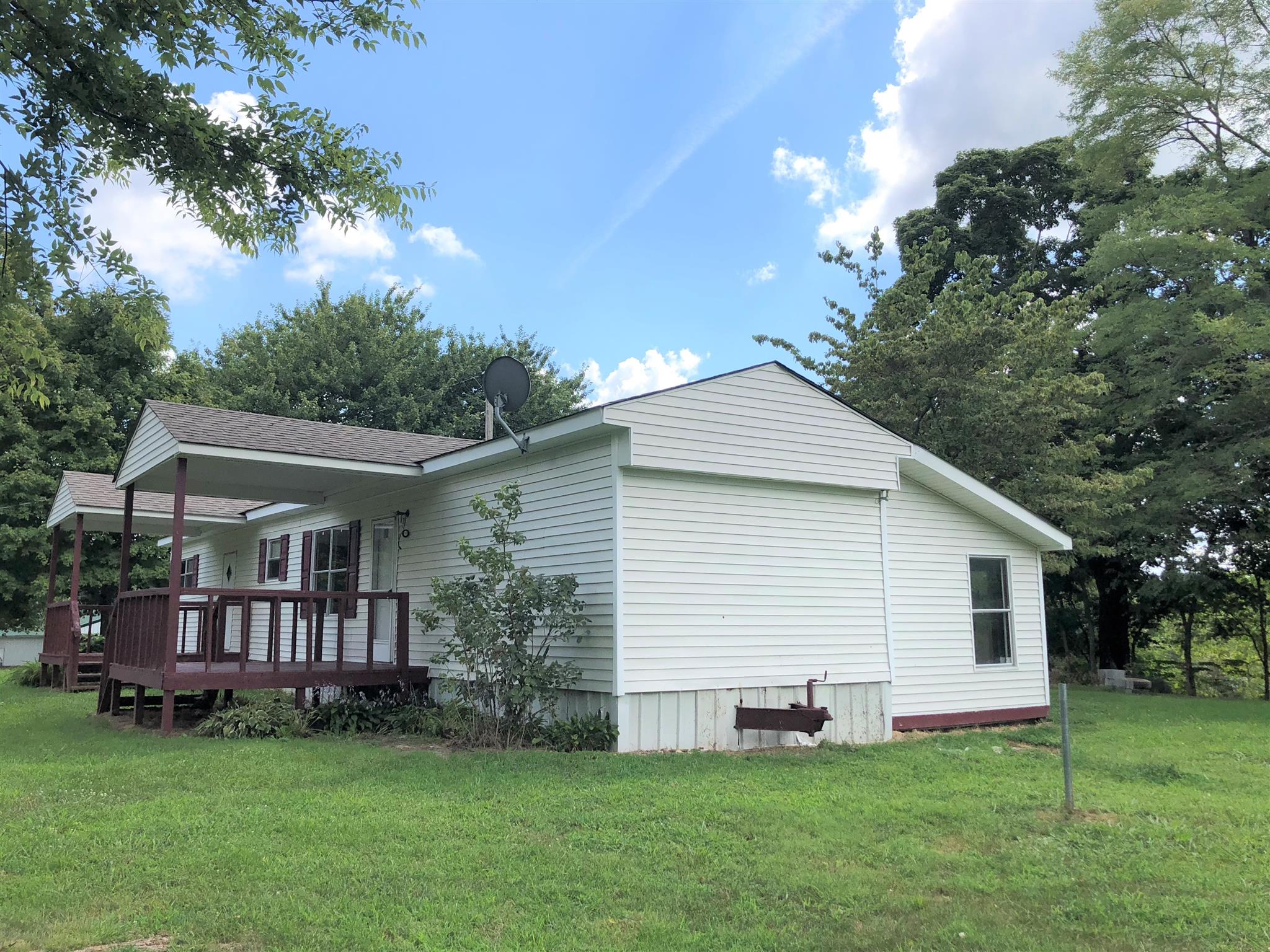 1560 Reese Road Bethpage, TN 37022 - Photo 15 of 22 a view of a house with a yard and deck