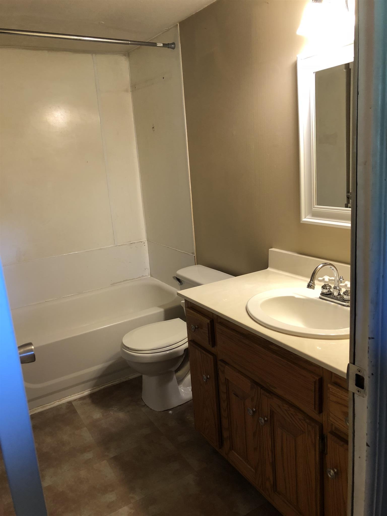 1560 Reese Road Bethpage, TN 37022 - Photo 22 of 22 a bathroom with a sink a toilet and shower