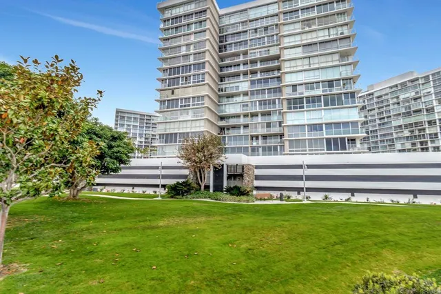 a view of a building with a yard