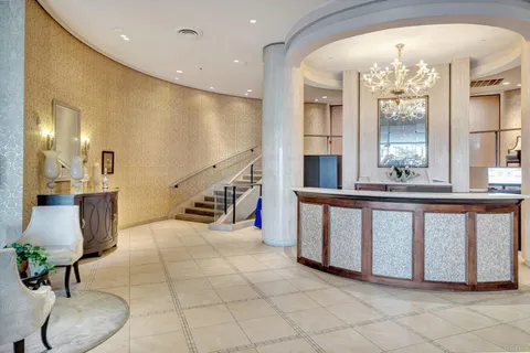 a view of an entryway with a chandelier
