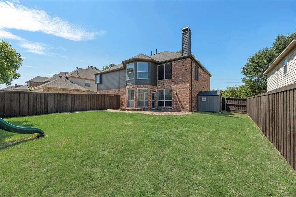 11104 Rogers Road Frisco, TX 75033 - Photo 33 of 37 Expansive green lawn with a privacy fence