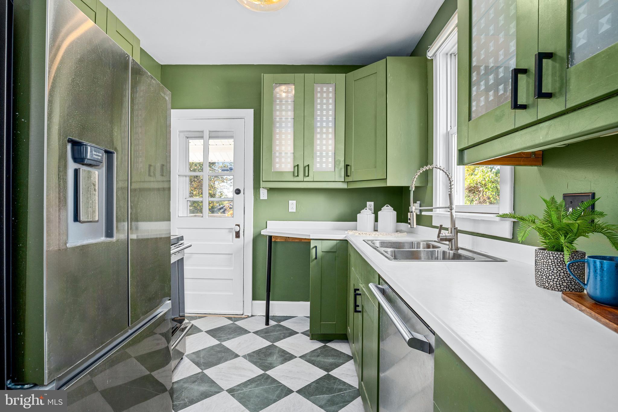 1327 Irving Street Northeast Washington, DC 20017 - Photo 14 of 39 a kitchen with a sink cabinets and window
