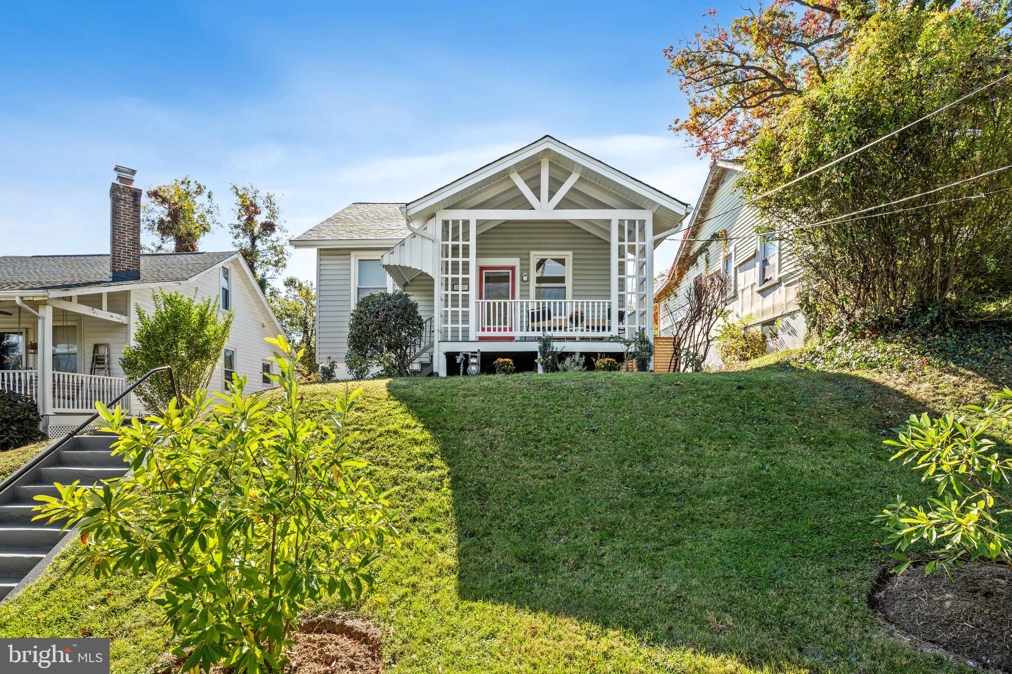 1327 Irving Street Northeast Washington, DC 20017 - Photo 2 of 39 a front view of a house with a yard