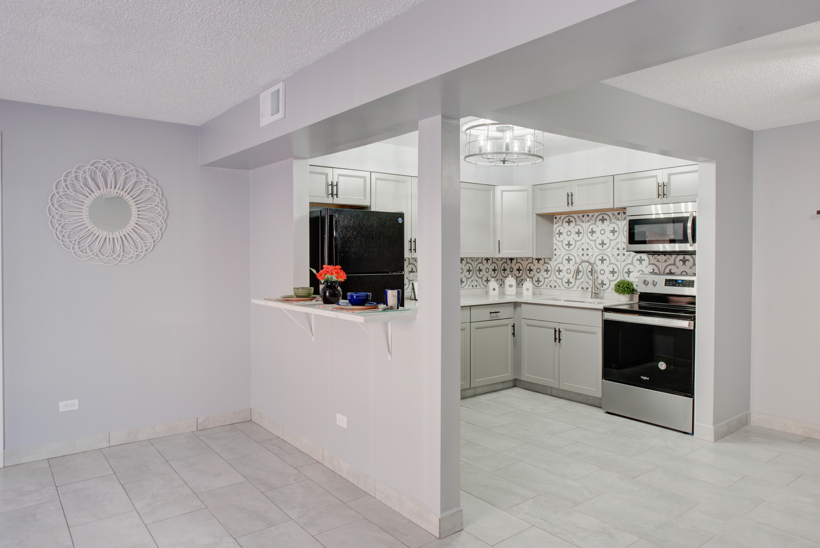 9708 Nottingham Avenue, Unit 5 Chicago Ridge, IL 60415 - Photo 11 of 16 a kitchen with a sink cabinets and stainless steel appliances