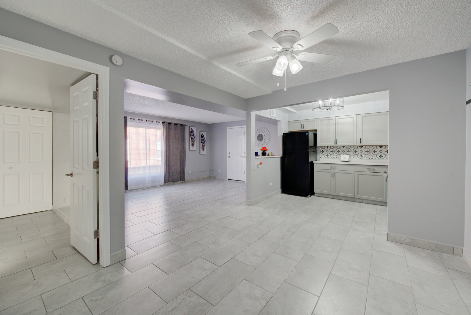 9708 Nottingham Avenue, Unit 5 Chicago Ridge, IL 60415 - Photo 3 of 16 a view of a kitchen with a sink and a refrigerator