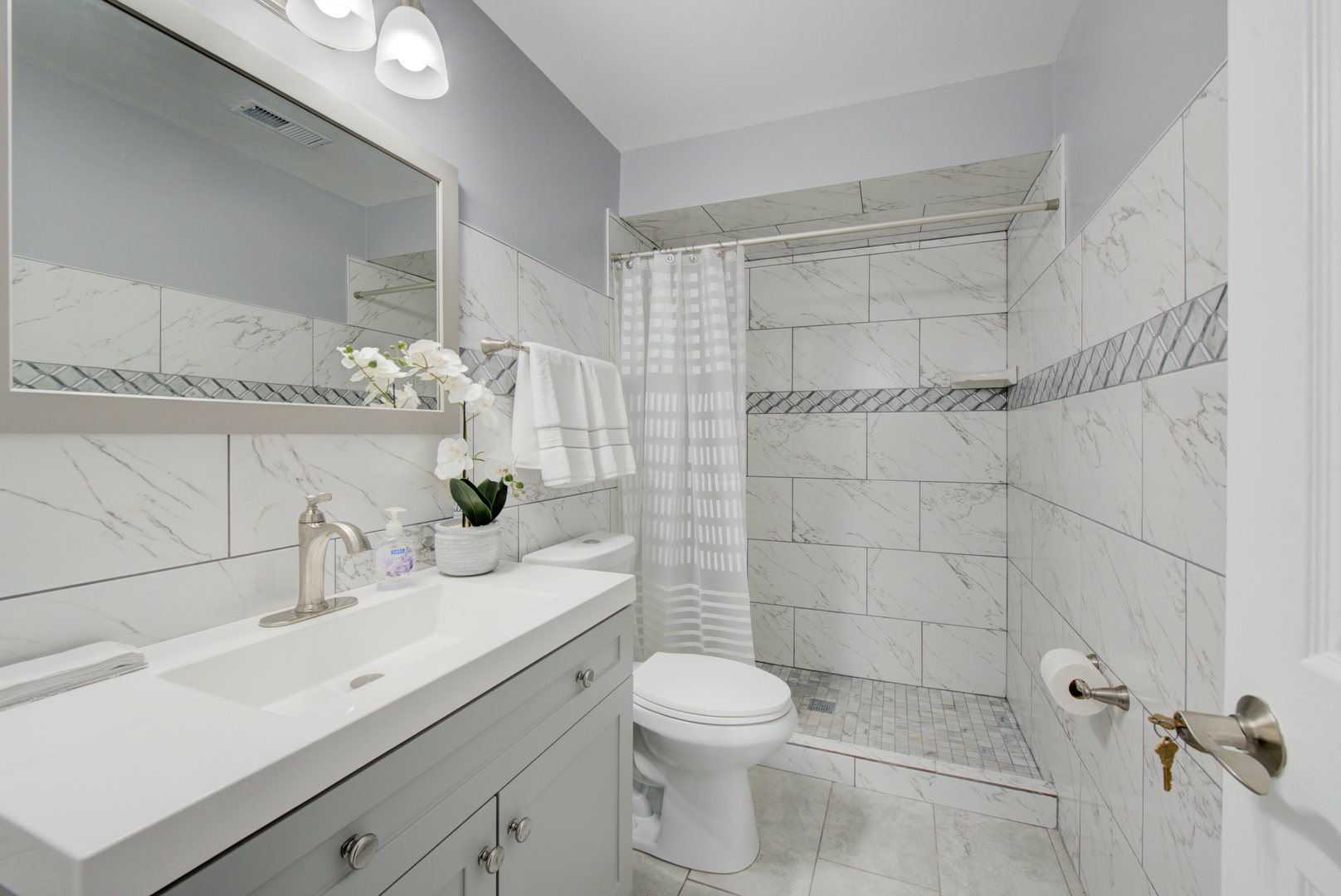 9708 Nottingham Avenue, Unit 5 Chicago Ridge, IL 60415 - Photo 5 of 16 a bathroom with a sink toilet and shower