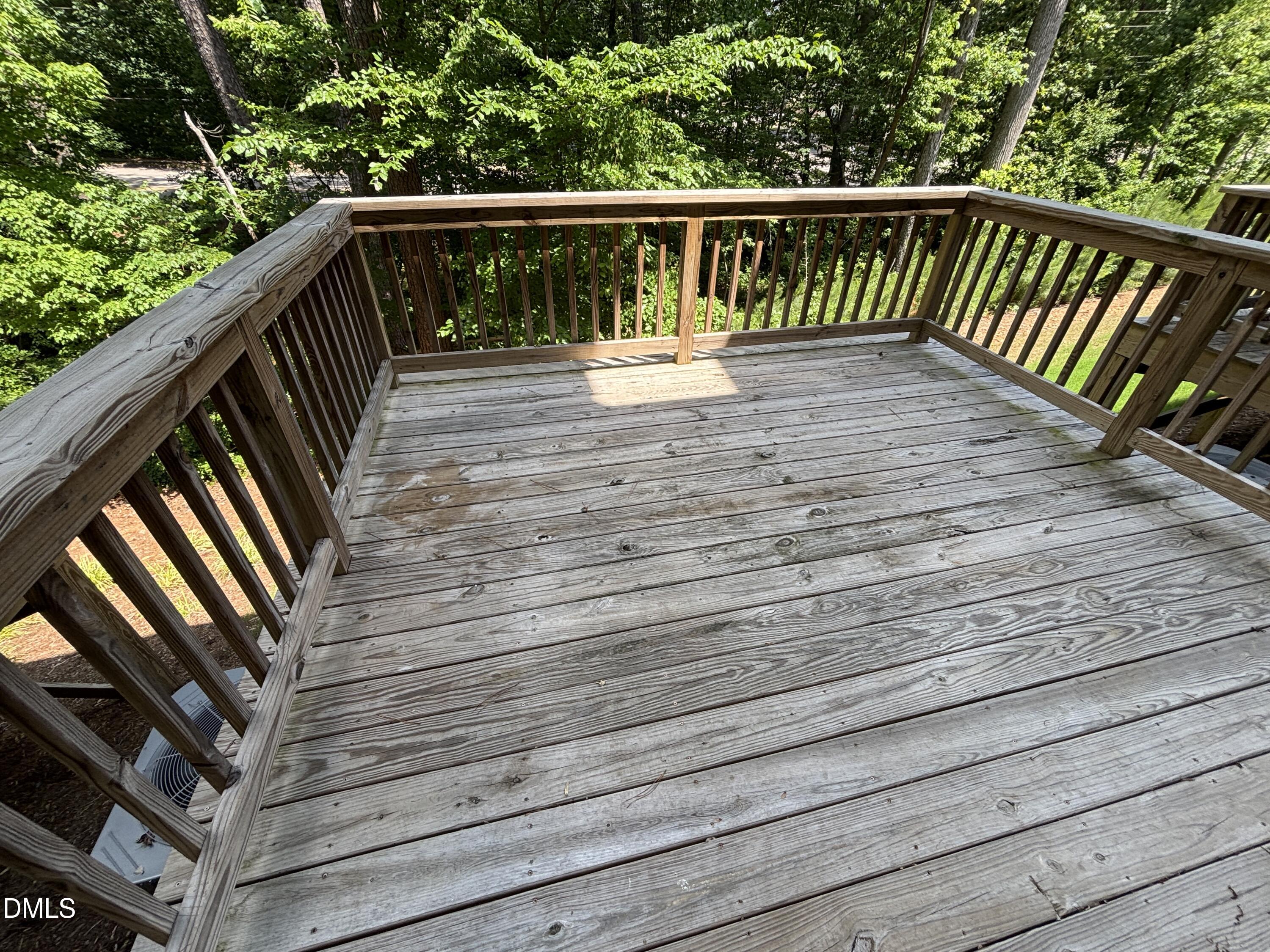 5710 Parker Pnes Court Raleigh, NC 27609 - Photo 31 of 78 a balcony with wooden floor