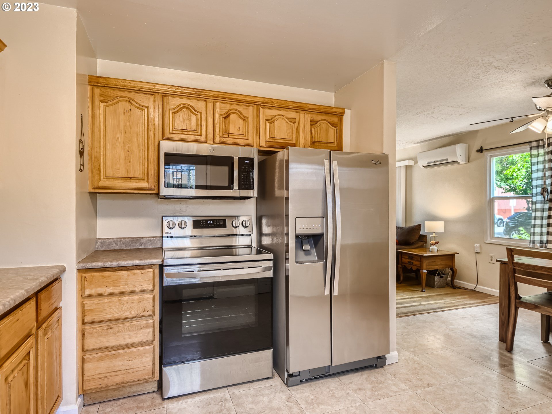 2546 Southeast 176th Place Portland, OR 97236 - Photo 11 of 24 a kitchen with stainless steel appliances granite countertop a refrigerator stove and sink