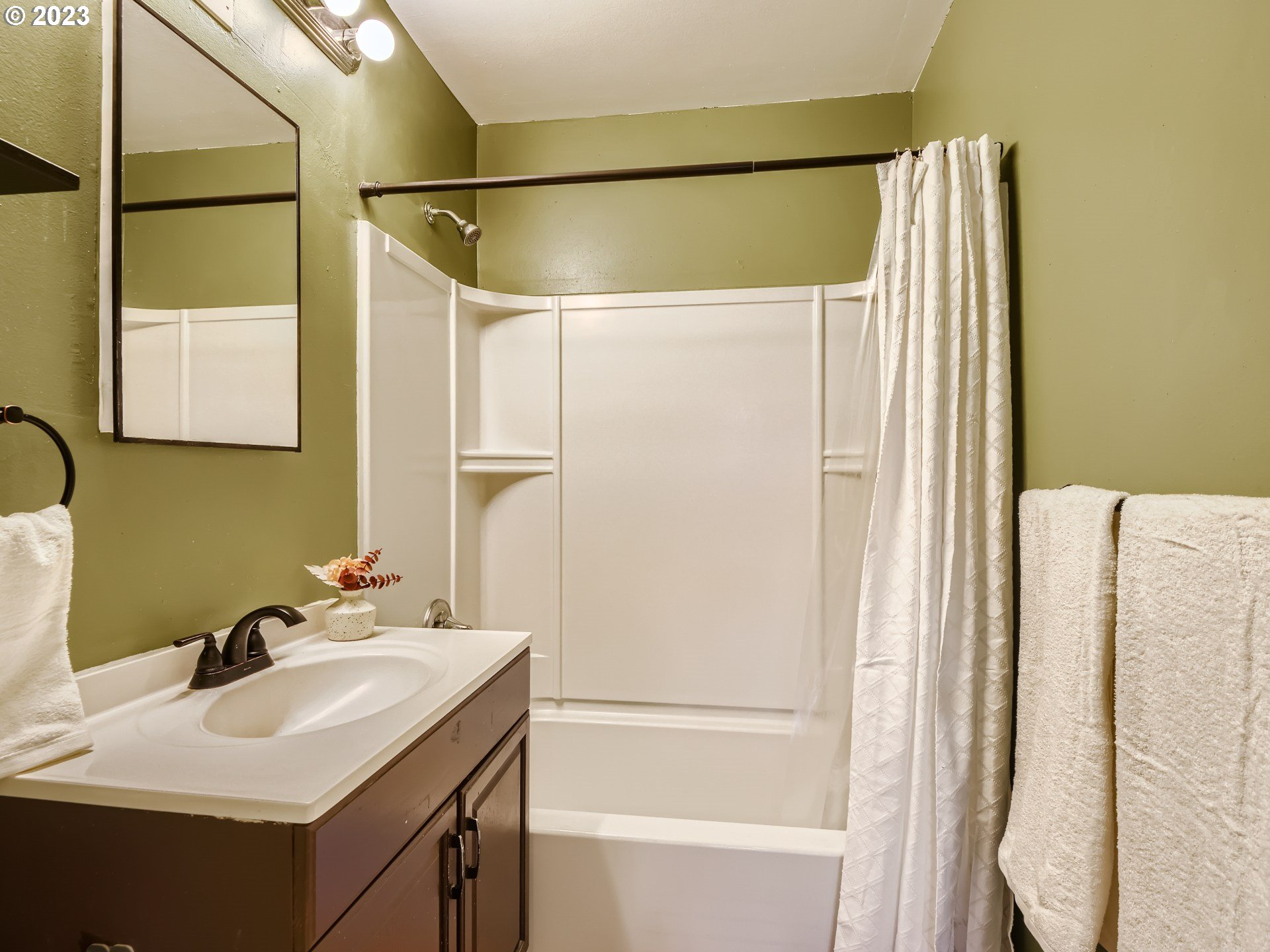 2546 Southeast 176th Place Portland, OR 97236 - Photo 14 of 24 a bathroom with a sink and a mirror