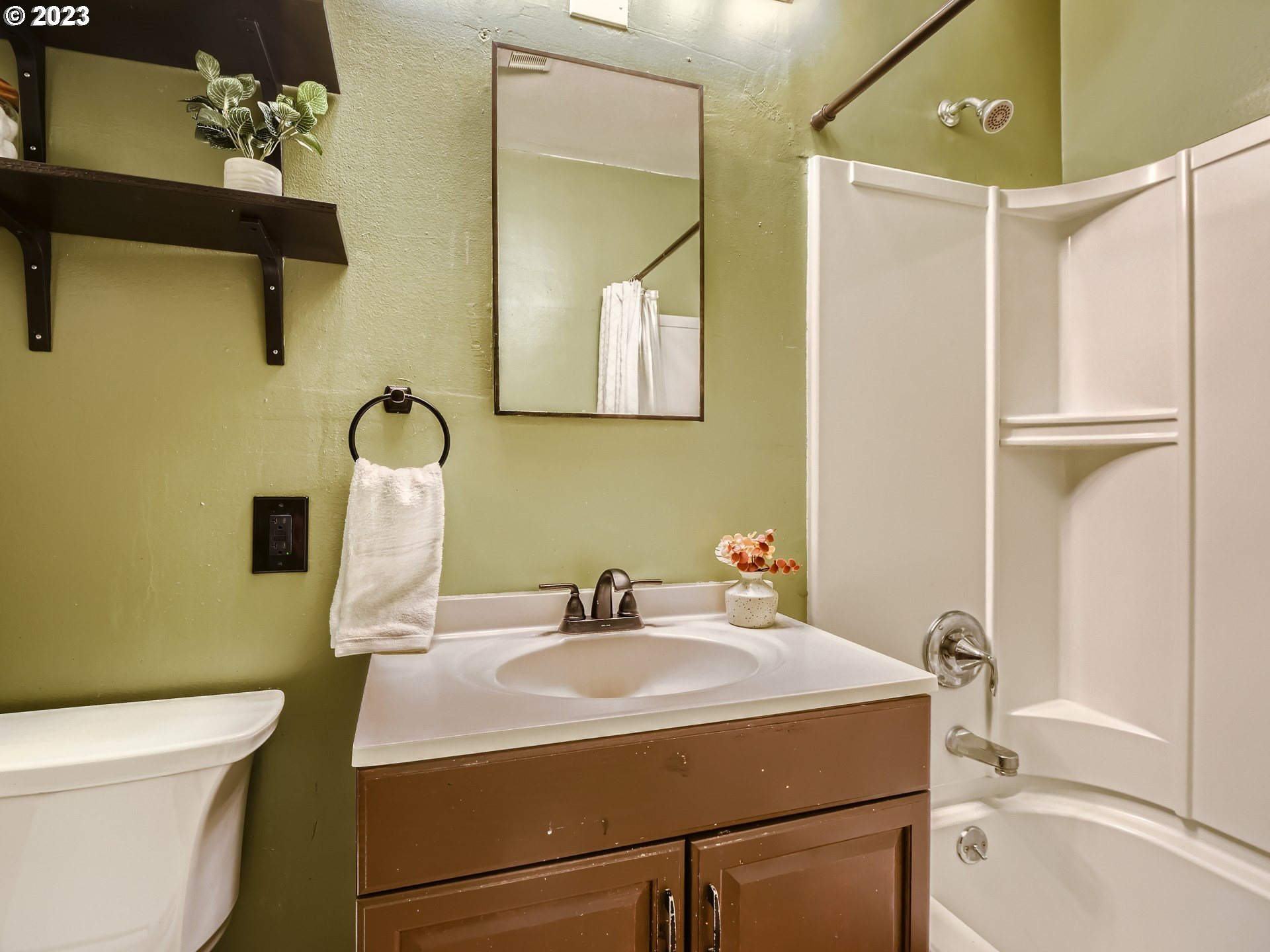 2546 Southeast 176th Place Portland, OR 97236 - Photo 15 of 24 a bathroom with a sink a toilet and shower