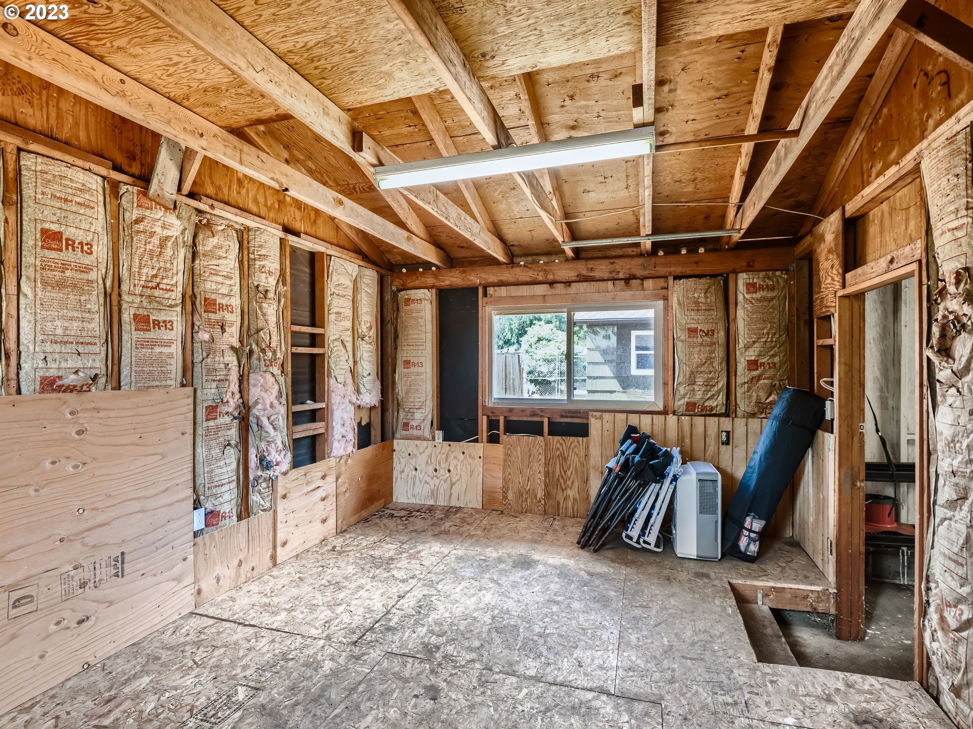 2546 Southeast 176th Place Portland, OR 97236 - Photo 20 of 24 a view of a room with wooden floor and furniture