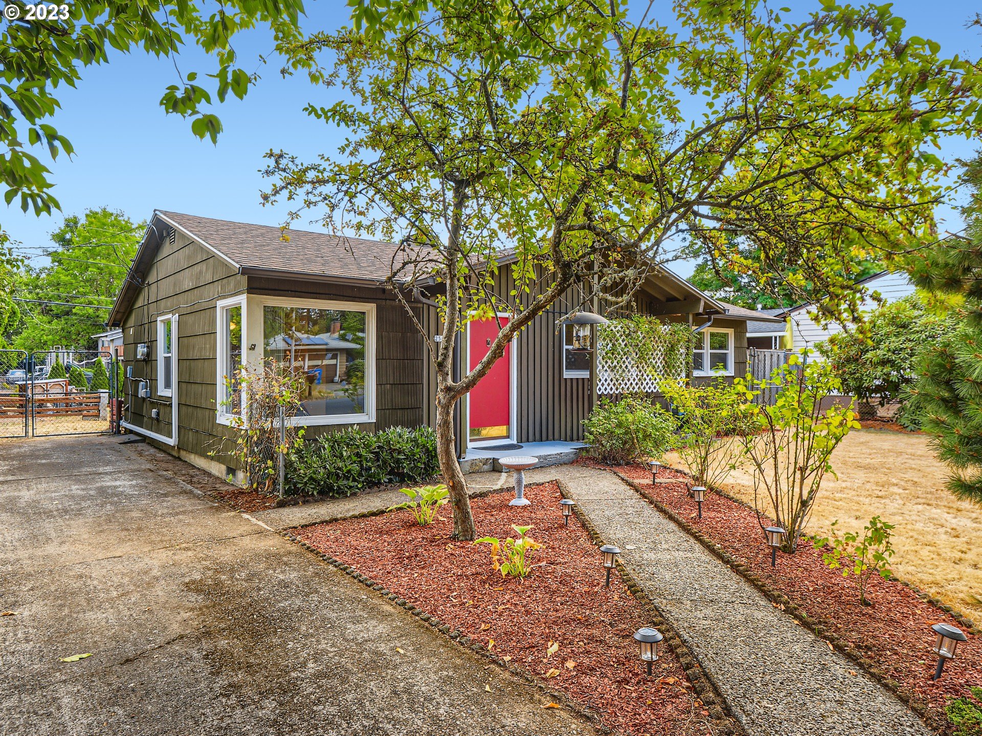 2546 Southeast 176th Place Portland, OR 97236 - Photo 2 of 24 a view of a house with a yard