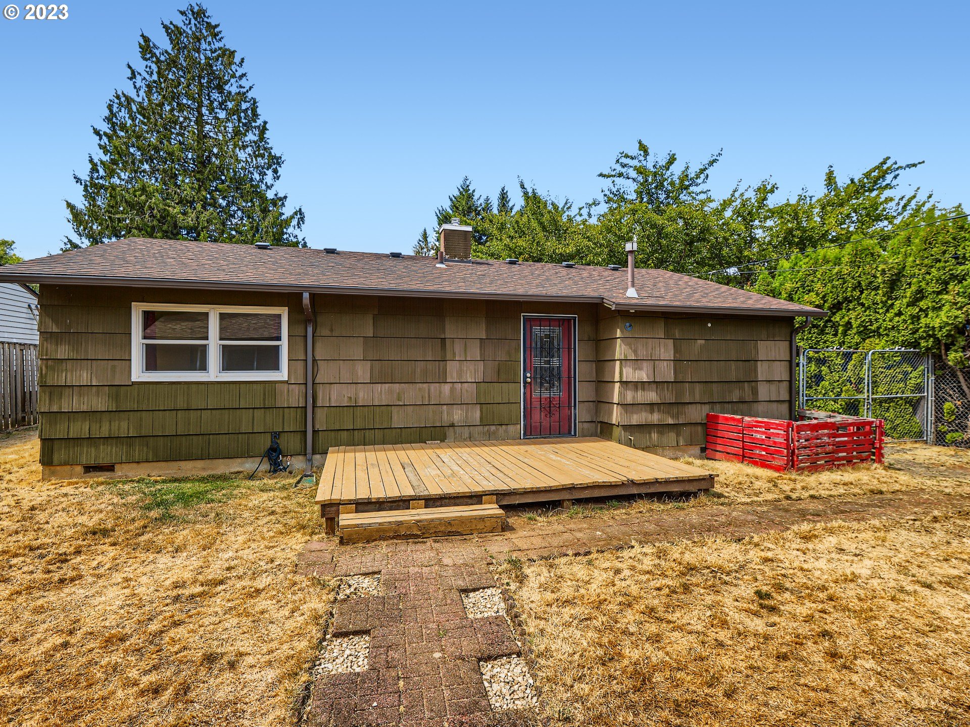 2546 Southeast 176th Place Portland, OR 97236 - Photo 23 of 24 a front view of a house with a garage