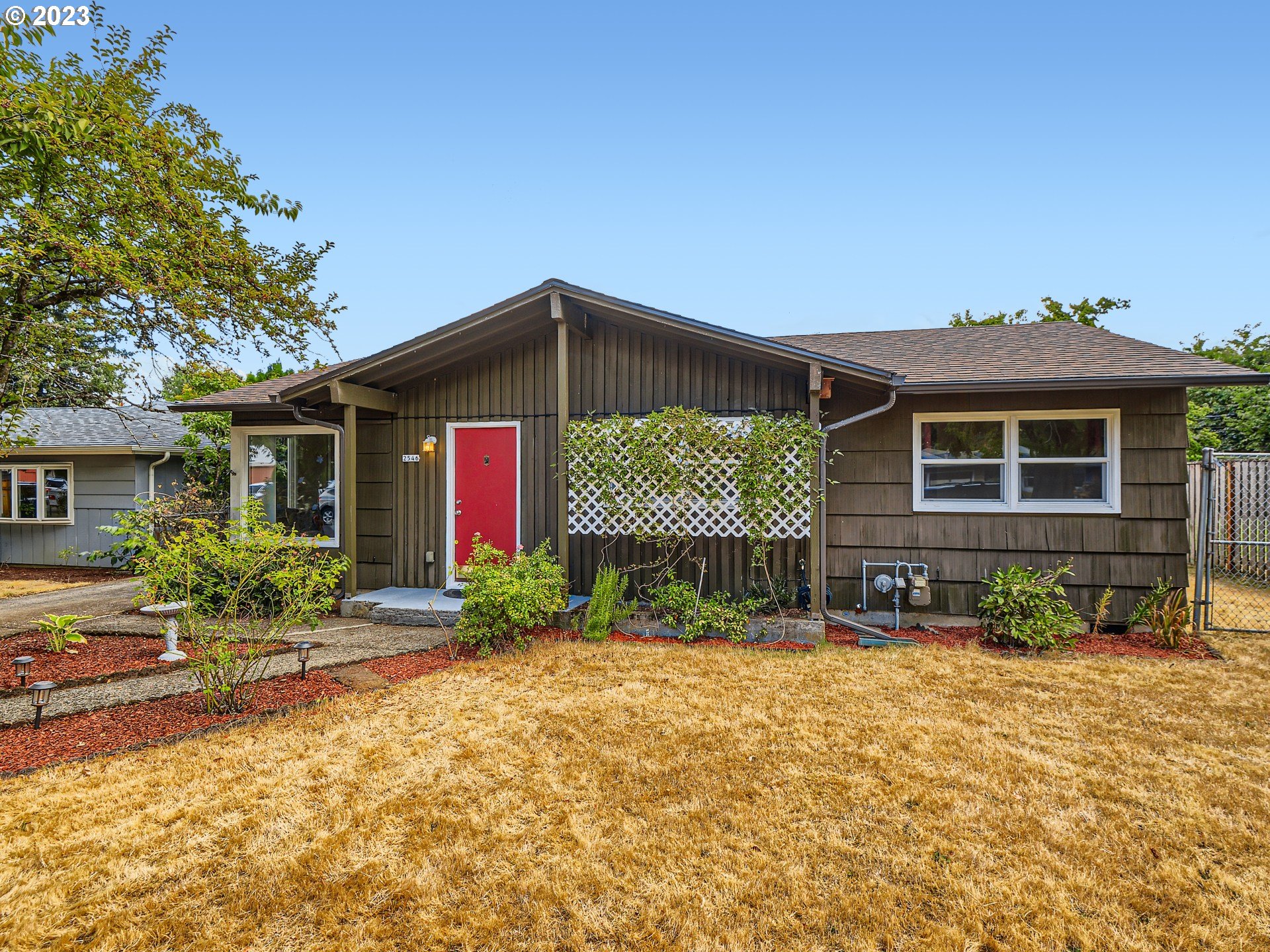 2546 Southeast 176th Place Portland, OR 97236 - Photo 24 of 24 a front view of a house with a yard