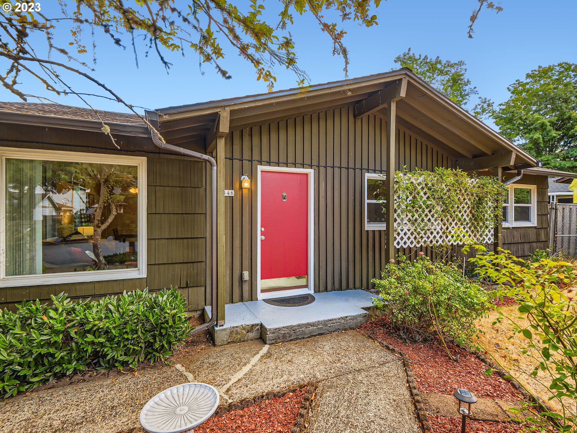 2546 Southeast 176th Place Portland, OR 97236 - Photo 3 of 24 a front view of a house with garden