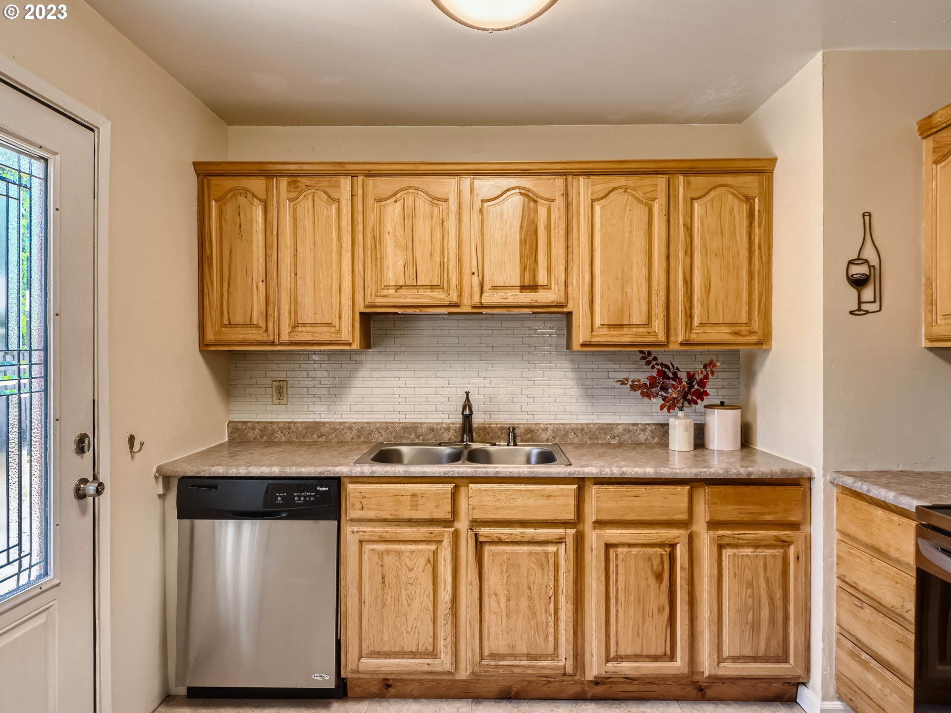 2546 Southeast 176th Place Portland, OR 97236 - Photo 10 of 24 a kitchen with stainless steel appliances granite countertop a stove a sink and cabinets